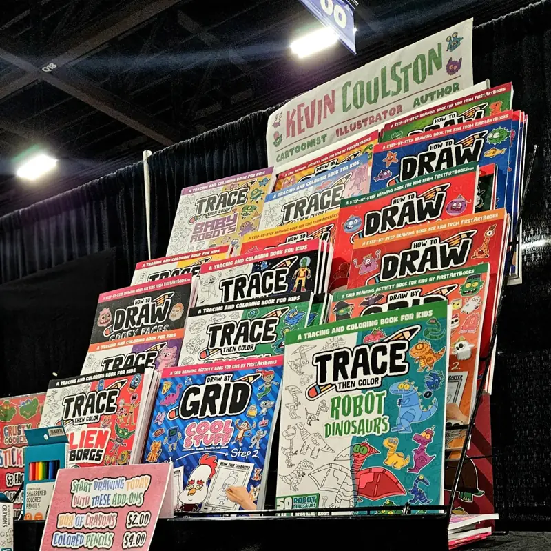 Kevin Coulston displaying his books at a comic convention